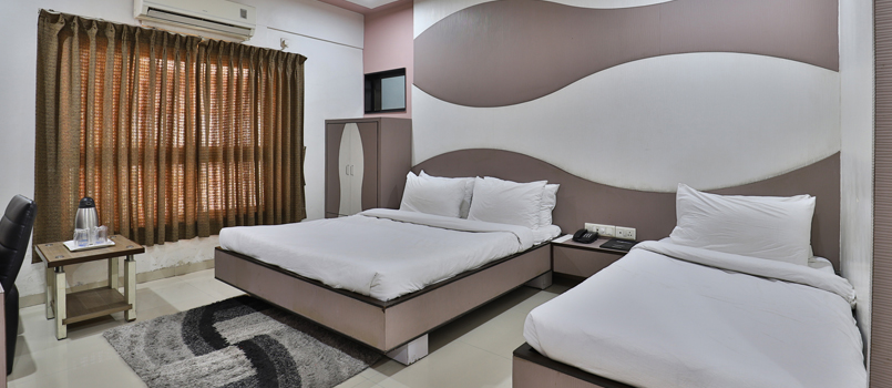 Nice interiored rooms at Hotel Merit Surat